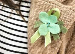 A Four Leaf Clover Boutonniere made of felt and ribbon.