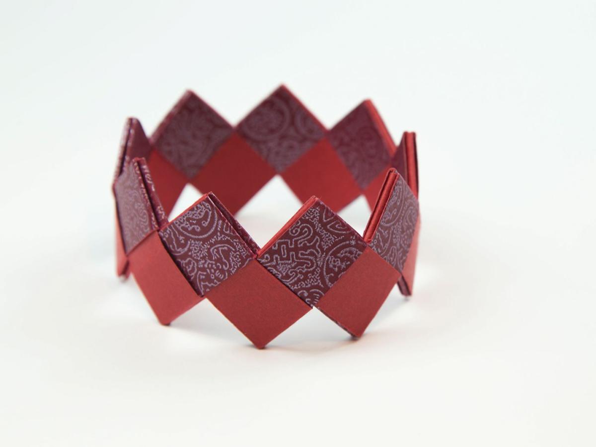 An origami bracelet made with red paper