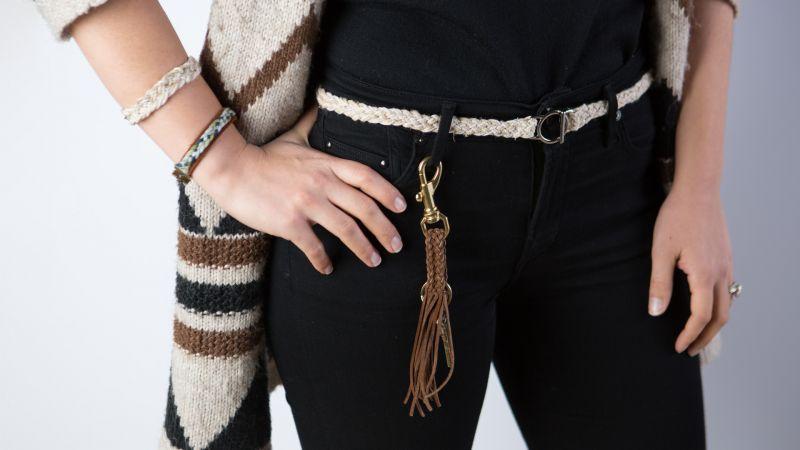 Person with braided leather key fob clipped to their belt loop